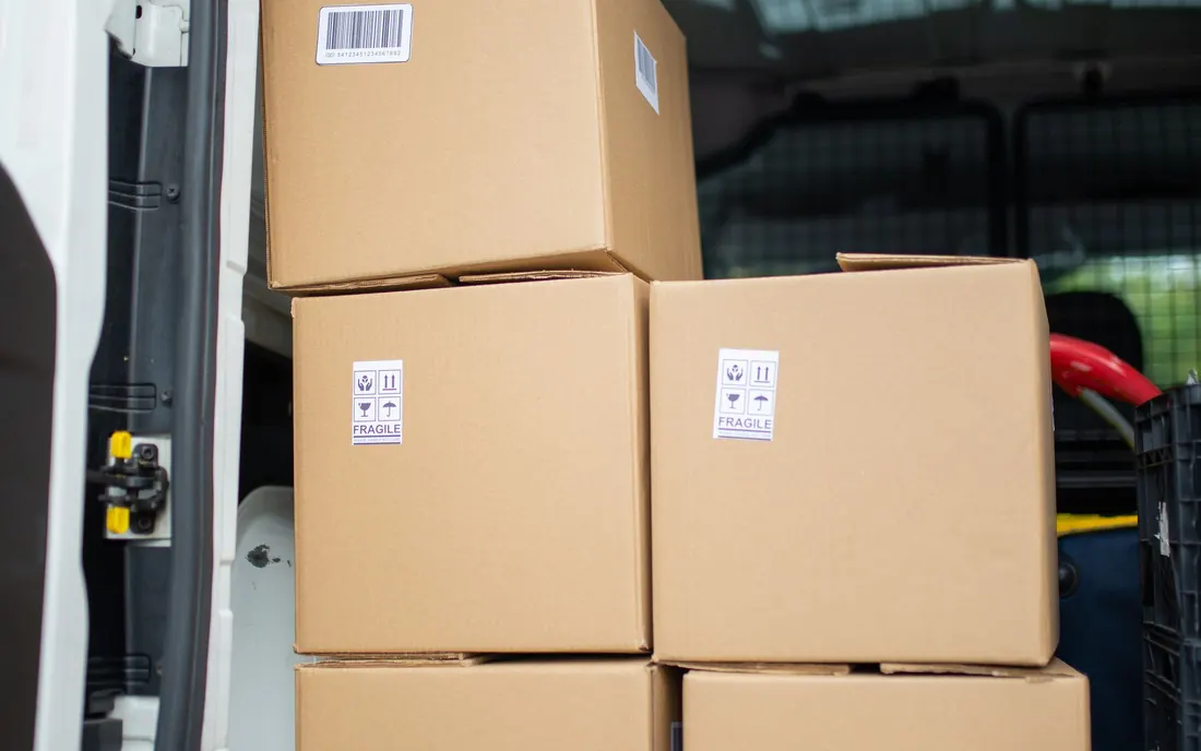 Packed cartons loaded in a delivery van, ready for dispatch